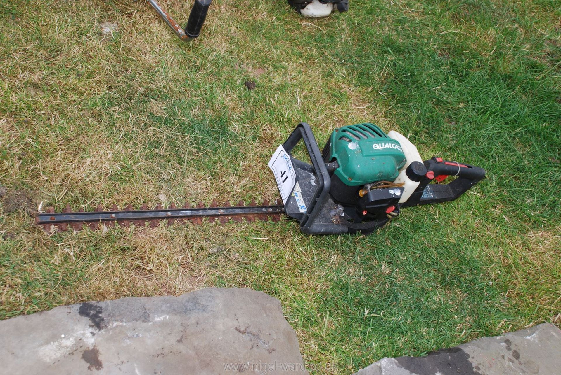 A Qualcast petrol engined hedge trimmer. Good compression.