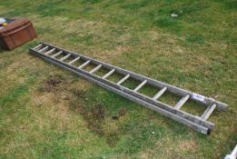 An Aluminium extending ladder, (2 x 14 rungs).