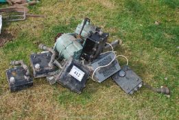 A quantity of electric generators, etc., possibly military vehicle type.