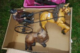 Wooden horse and rider and wooden cat.