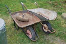 Two wheelbarrows.