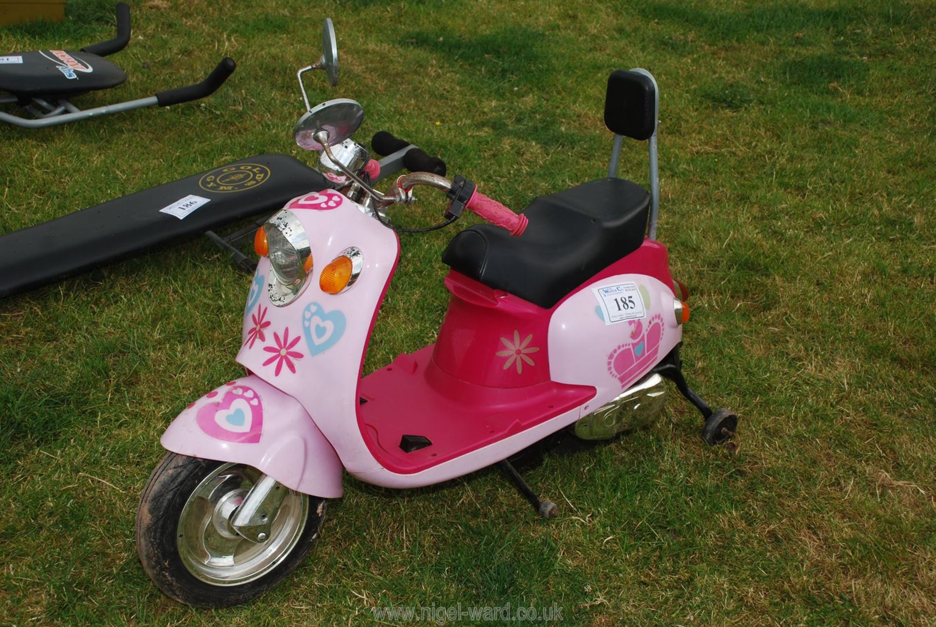 A child's motor scooter with stabilisers.