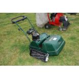 An ATCO Balmoral 17 S lawn mower with lawn raker attachment- running at time of lotting.