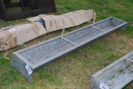 A galvanised feed trough, 8' long.