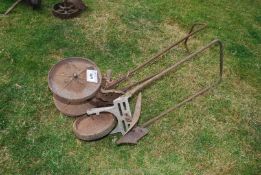 Two push along garden cultivators.