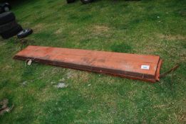 A Howard muck spreader lid, 10' long approx.
