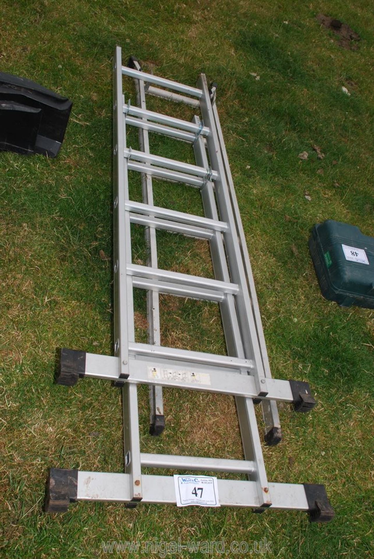 Two galvanised ladders; one being extendable.