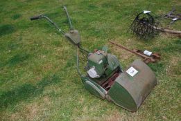 A Atco petrol lawn mower with grass box, (good compression but no fuel present).
