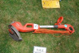 A Flymo Power Time 500 electric strimmer.