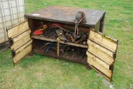 A steel welding bench and vice, 49'' x 39 1/2'' x 32 1/2'', plus a large quantity of tools within.