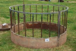 A round sheep bale feeder.