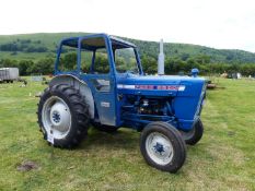 A 1972 Ford 3000 Diesel Tractor with safety frame/cab. XHR 220K. Good running order.