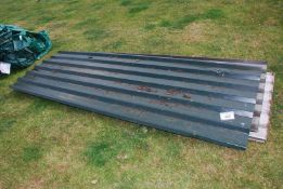 Various lengths and off-cuts of metal roofing sheets.