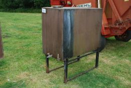 A Fuel tank on stand with delivery hose, 4' x 2' x 3'.