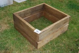 A raised flower bed 33 1/2" x 30".