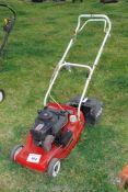 An Empress petrol rotary Mower with grass collector (good compression) but no fuel present.
