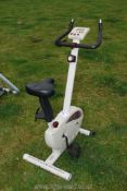 A "Gold Gym" exercise bike.