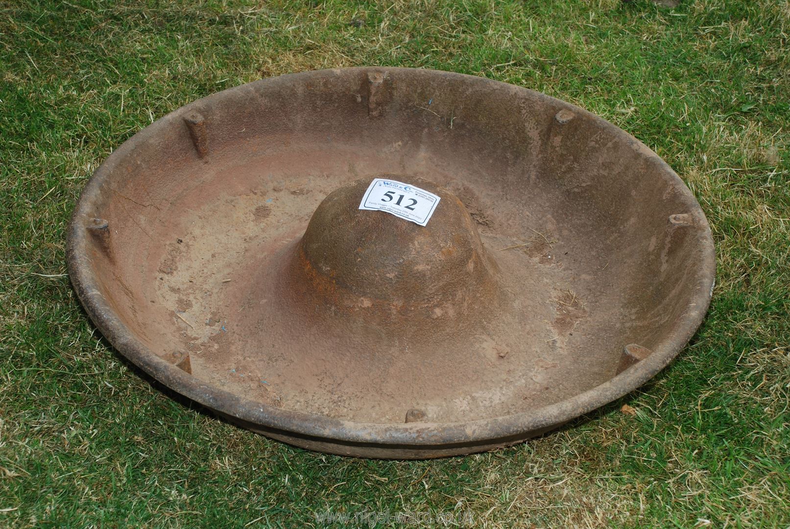 A cast iron pig round feeder, 3' diameter.