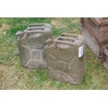 Two jerry cans, 1951 and 1976.