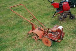 A Briggs & Stratton petrol engined rotavator 10" width (cultivating).