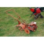 A Briggs & Stratton petrol engined rotavator 10" width (cultivating).