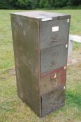 A four drawer metal filing cabinet.