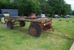 A four wheel wagon/trailer, 15'5" long x 6'6" wide.