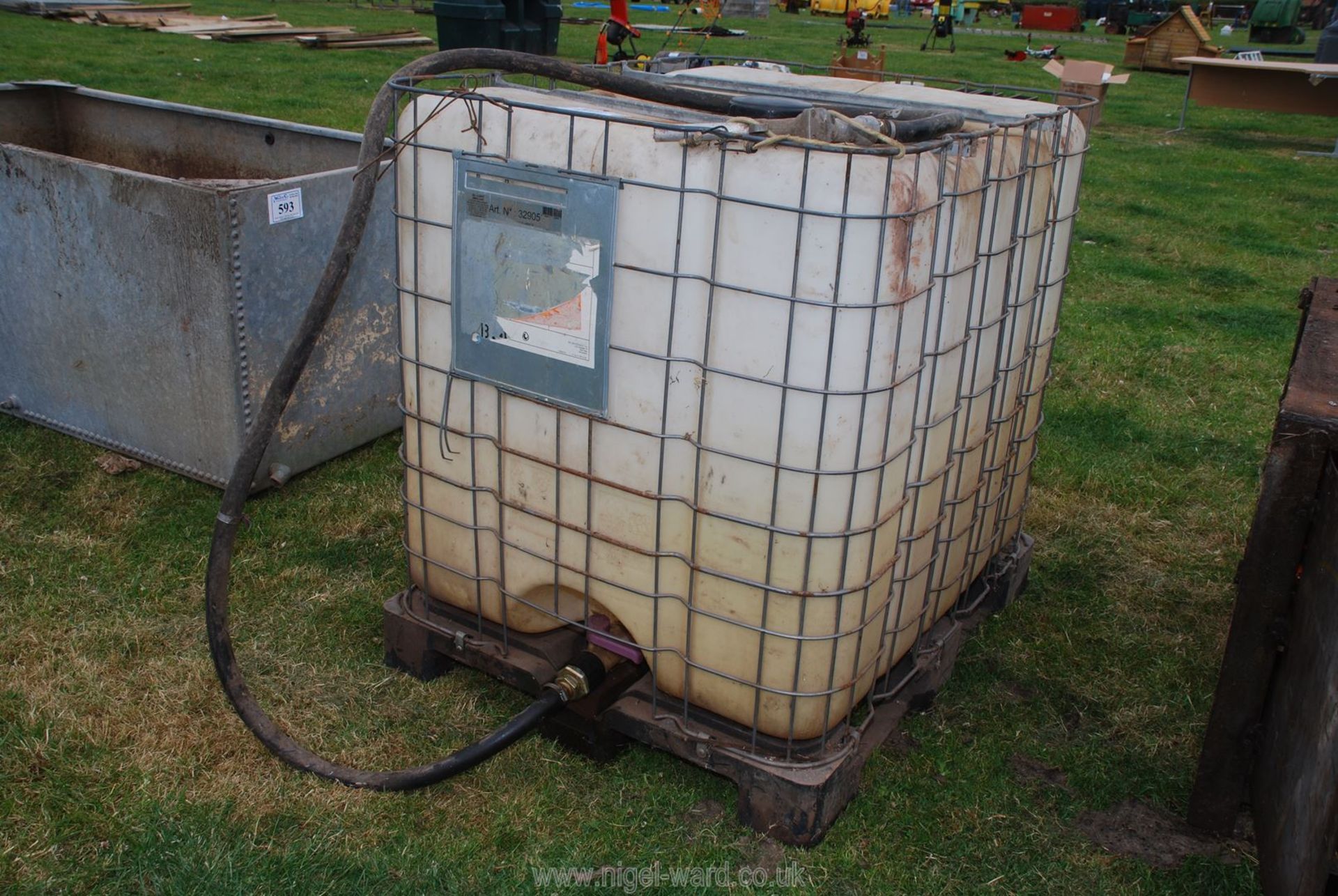 An IBC tank with fuel delivery hose.