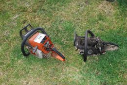 An MS 310 chainsaw engine plus one for repairs. (unable to start, no fuel present).