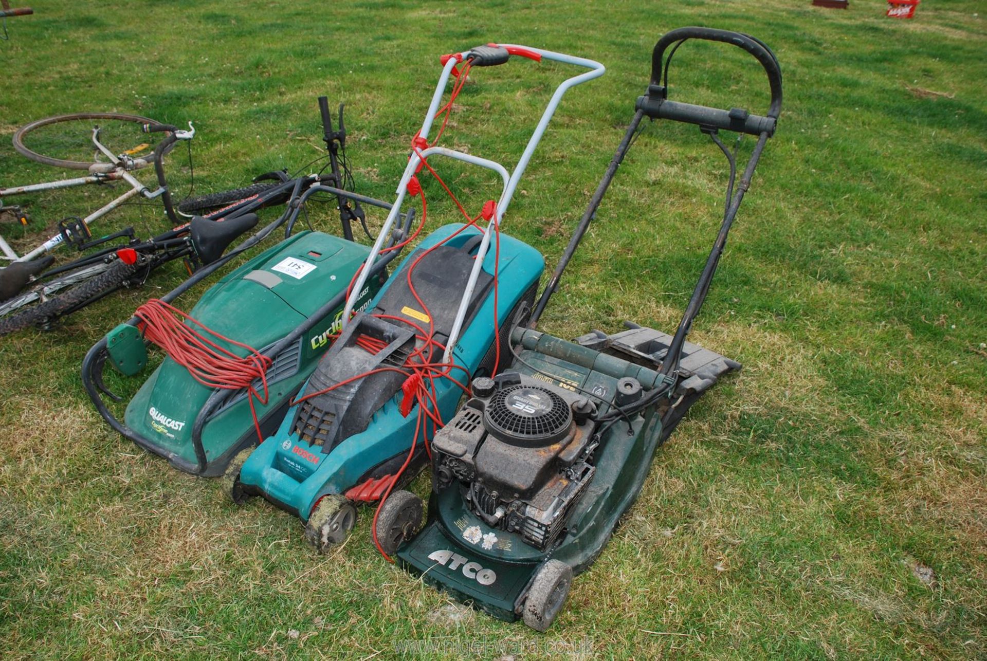 Two electric lawn Mowers (Bosch & Qualcast) and an Atco petrol rotary mower.