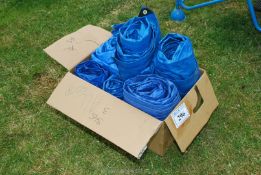 6 small plastic tarpaulins.