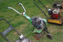 A rotary cultivator with Briggs & Stratton engine (good compression).