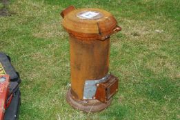 A small cylindrical cast iron stove 25 1/2" high x 13" diameter.