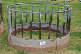 A round sheep bale feeder.