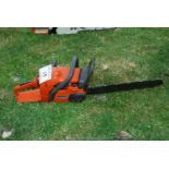 A Husqvarna chainsaw with chain-brake, good compression. Ran at time of lotting.