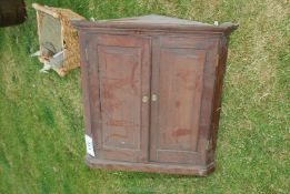 An Oak cupboard 30 3/4" high x 29 1/4" wide.