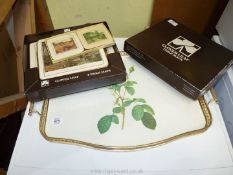 A tray with boxed set of Cloverleaf table mats and coasters.