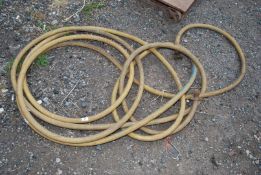 A length of yellow rubber hose.