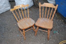 Two pine kitchen chairs.