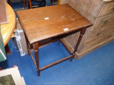 Dark wood occasional table 23 1/2" x 17" x 28" high.