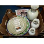 A box of china including; graduated oriental vases, wall mask, plates, etc.