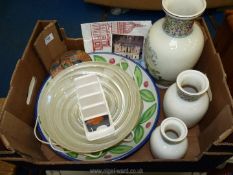 A box of china including; graduated oriental vases, wall mask, plates, etc.