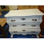 A grey painted bedroom chest with drop down front.