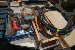 A roll of armoured cable, tray of assorted chisels, lump hammer, two tray boxes etc.