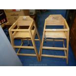 Two wooden high chairs.