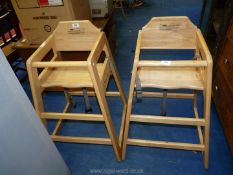 Two wooden high chairs.