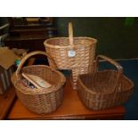A quantity of wicker baskets and sewing baskets with contents.