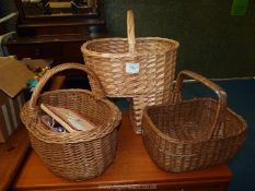 A quantity of wicker baskets and sewing baskets with contents.