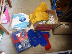 A box containing two pairs of cotton overalls (as new), five pairs of heavy suede gauntlet gloves,