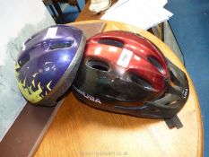 Two bike helmets.